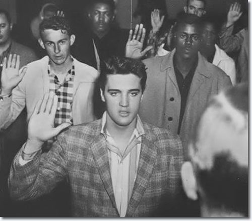Elvis Presley is sworn into the Army on March 24, 1958 at Fort Chaffee Arkansas.