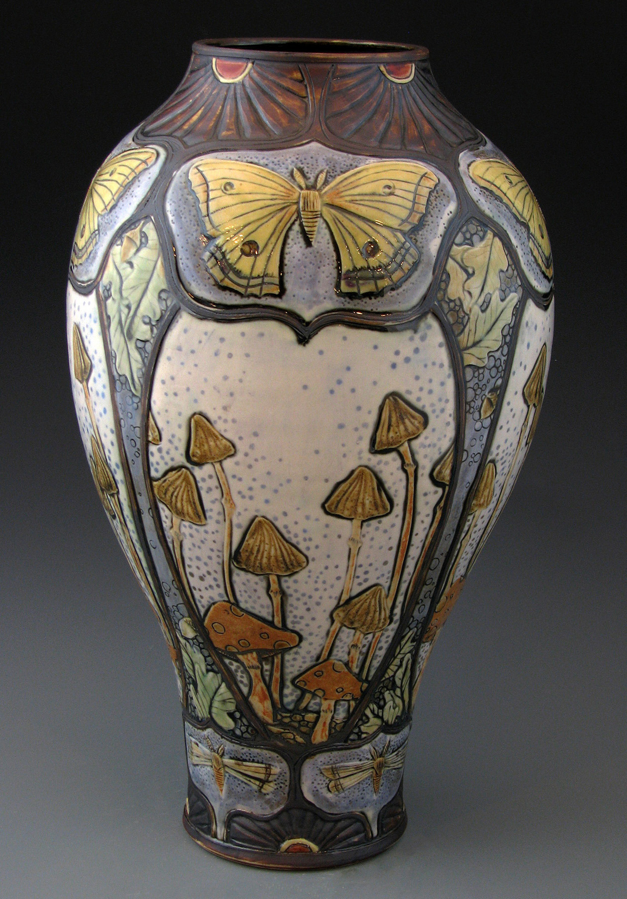 stephanienouveau:

Did I ever show you this?  I can’t remember.
Moth and Mushroom Vase.  Pretty Big. Lots of Detail.  Fired it a few times to get it just perfect. 
