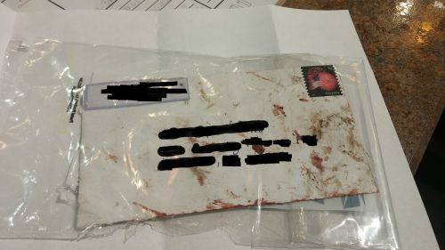 sixpenceee:

A reddit user received this in the mail with a note from the USPS, that said “The carrier who services your route was involved in a Industrial or Motor Vehicle incident. Due to the incident your mail came in contact with blood” (Source)
