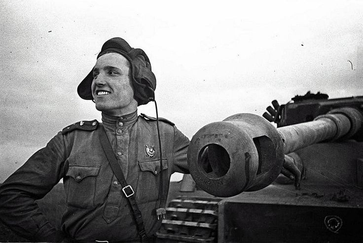 A Russian tank commander with a Knocked out Tiger I