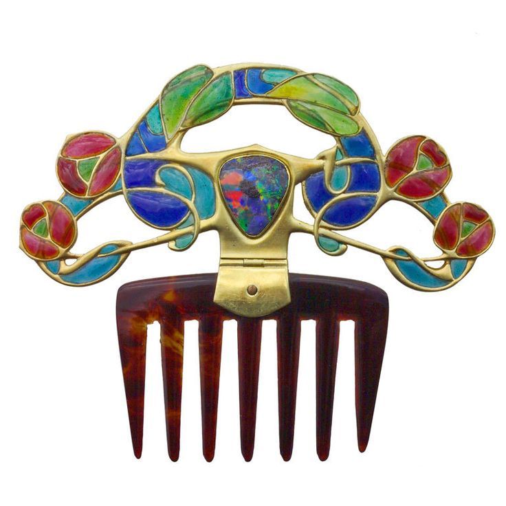 detournementsmineurs:

An Important Diadem Comb in gold with a fiery central opal set amongst gold entrelacs of flowers and foliage enriched with plique-à-jour enamel, by Archibald Knox for Liberty &amp; Cothe, UK, 19th Century.
