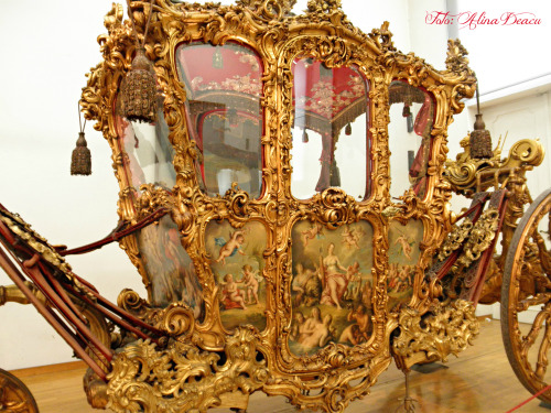 Imperial Carriage – Sisi’s Hungarian Coronation Carriage by Alina DeacuThe Imperial Carriage was the most high-ranking coach of the Vienna court. As the imperial state coach, it was a “throne on wheels” and thus an insignia representing the power of the dynasty. It was used only for the most important events, such as weddings or solemn entries.
Empress Elisabeth also used this magnificent Baroque coach (which had been brought to Hungary for the purpose) on 8 June 1867, when she drove to her coronation at Budapest’s Matthias Church amidst general rejoicing.
Almost 50 years later (1916) the Imperial Carriage was used for the last time, during the Hungarian coronation of Emperor Charles, when it carried Empress Zita and Crown Prince Otto to the church.