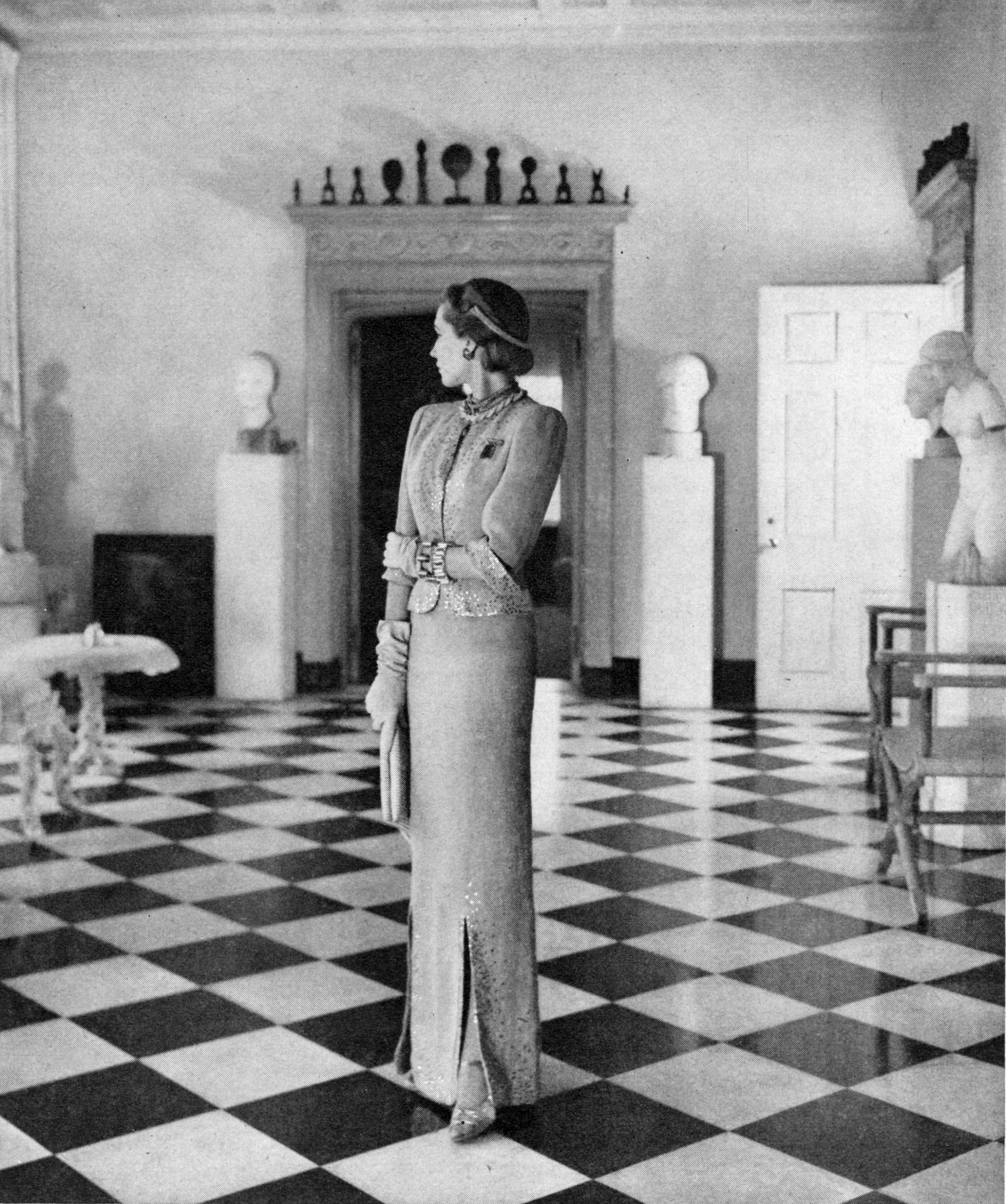 

A fashion shoot for Bergdorf Goodman staged in the foyer of Helena Rubinstein’s New York home at 625 Park Avenue by John Rawlings, 1944

