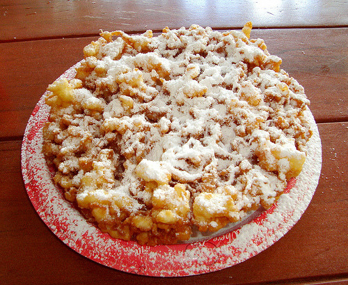 ... funnel!With a pair of kitchen tongs quickly turn the funnel cake over