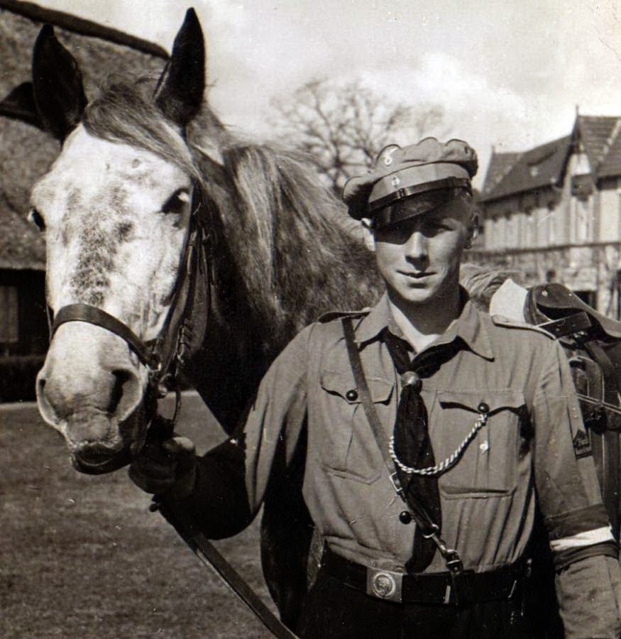 A young Ernst Barkmann (The famous Waffen SS Panther Commander) as a member of the Hitler Youth with a Horse.