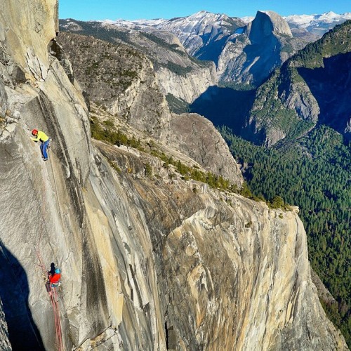 chrisburkard:

This is what it looks like hanging in space 3,000 ft over the valley floor watching @tommycaldwell @kjorgeson climb the final pitch of the #dawnwall .. Very vantages give you this kind of perspective in the valley ..
History in the making today in Yosemite National Park (at Dawn Wall Summit)
