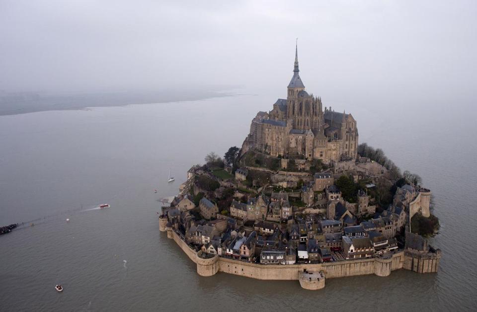 prints:

Rare supertide turns ancient Mont Saint-Michel into island
