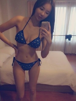 Skinny hot Asian girl in tiny bikini.
