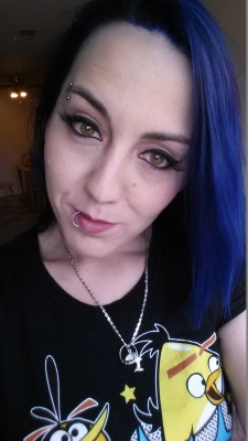 HarleyQuinn420 has brilliant blue hair, and soft green eyes