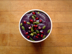 garden-of-vegan:  Blueberry-Banana-Pear Smoothie ( 1 cup water, 1 frozen banana, &frac34; cup frozen blueberries, &frac12; a frozen pear, 1 scoop pumpkin seed protein, and 1 tbsp almond butter) topped with pomegranate seeds and raw pumpkin seeds. 