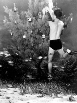 Bud Bassette decorating underwater Christmas Tree, 1948.