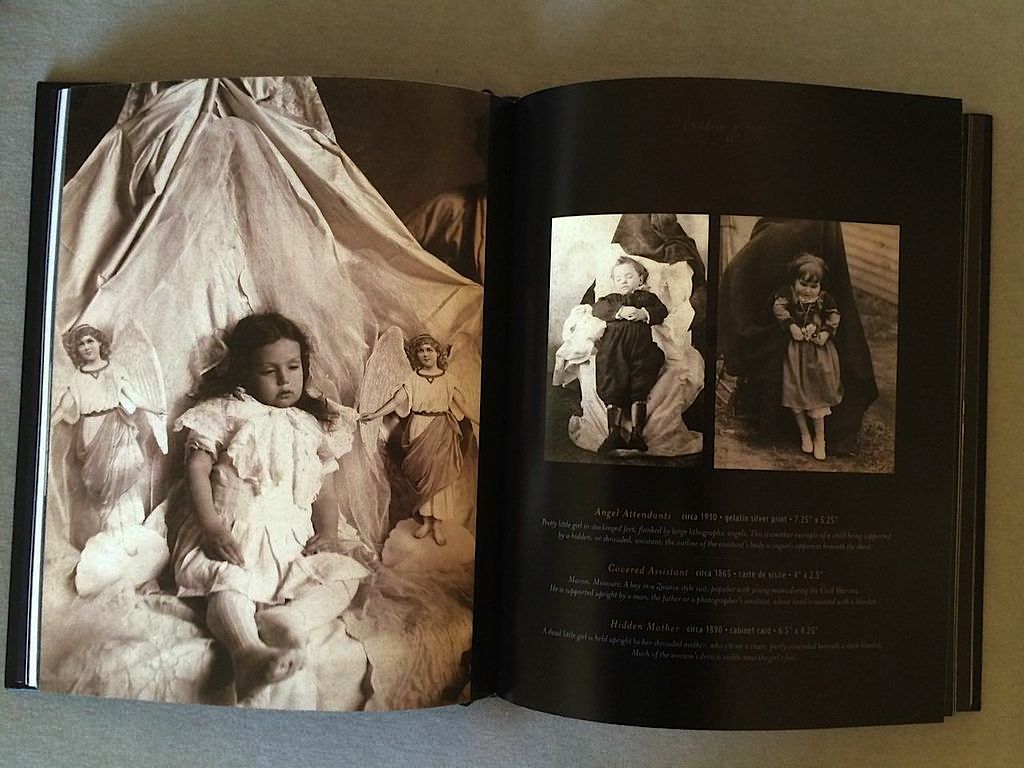 Beyond the Dark Veil – A beautiful, and beautifully macabre, collection of Victorian post-mortem photography
Beyond the Dark Veil: Post Mortem and Mourning Photography from the Thanatos Archiveby The Thanatos ArchiveLast Gasp2014, 200 pages, 7 x 9 x 0.8 inches$21 Buy a copy on Amazon
During the Victorian era, with the popular spread of photography, and before the emergence of a funeral industry, the practice of home post-mortem photography had its heyday. It was common to have your deceased loved ones photographed, not only while lying in state, but sitting in chairs, standing up (with the aid of special corpse stands), even posing with living members of the family. It was as though, given the advent of the photograph, people felt as though they could keep their loved ones alive longer by taking pictures of them. And those pictures weren’t hidden away, to be privately wept over in melancholy remembrance, but prominently displayed in the most public areas of the home.
Beyond the Dark Veil is a handsome new volume from Washington state’s Thanatos Archive, published by Last Gasp (perfect casting there!), exploring this fascinating, now seemingly macabre death practice. This is a gorgeously-produced hardbound book with an embossed, gold-foiled black leather cover and golden-edged pages. Photography comprises the bulk of the content here, but there are also essays from Jack Mord (owner of the Archive), author and death researcher Bess Lovejoy, artist Marion Peck, poet Joanna Roche, historian of photography Joe Smoke, and others.
The book contains 194 images, which include deathbed post-mortem photos, photos of dead children and families, adults, crime and tragedy post-mortems, and even photos of dead pets. The book also serves as a fascinating survey of late 19th century imaging technologies, with hand-colored photographs, albumen prints, ambrotypes, cabinet cards, carte de viste, daguerreotypes, gelatin silver prints, opaltypes, photo postcards, stereoviews, and tintypes, all from the extensive collection of The Thantos Archive.
Peppered throughout are also newspaper clippings, ads for funeral products, images of caskets, hearses, funeral trains, and other tools and ephemera of Victorian death and mourning. There is even a brief glossary of 19th century photography terms. – Gareth BranwynDecember 3, 2014
