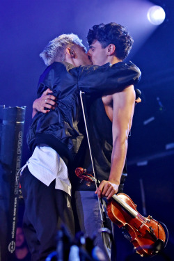 yearshq:  Olly Alexander of Years &amp; Years kisses boyfriend Neil Amin-Smith of Clean Bandit as they perform on the main stage at the 2015 Jersey Live Festival at Saint Helier on September 05, 2015 in Jersey, England 