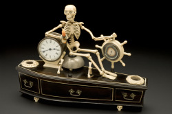 hyperallergic:  (via Time for Death: Skeleton Alarm Clock Goes on Display in London) Would you like to wake from dreams with a reminder of your inevitable eternal sleep? An alarm clock currently on view at the British Library in London, which is part