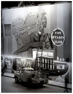 burleskateer:  In a press photo dated from the mid-1950′s, a worker can be seen making repairs to the signage at Martha Raye’s Original ‘5 O’CLOCK CLUB’ ; located at 215 22nd Street (at Collins Avenue), in Miami Beach.. Burlesque dancers Tee