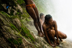yearningforunity:  Haitian women perform a bathing and cleansing ritual under the waterfall during the annual religious pilgrimage in Saut d'Eut, Haiti.