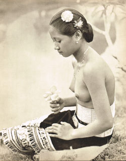 Bornean Dayak girl, via Buy Vintage Ads.