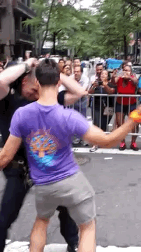 buzzfeed:  A Hot Cop Got Down At NY PrideThe purple-shirted dancer, Aaron Santis, told BuzzFeed News he’d been trying — and failing — to dance with cops all day. Then he spotted our heroic hot cop and thought he’d try one more time.“I didn’t