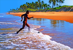 douglassimonson:Beautiful Bahia, photograph of Israel kicking a soccer ball in the surf not far from Salvador, by Douglas Simonson