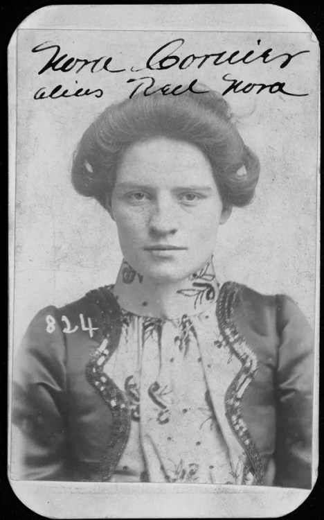 Nora Courier was better known as “Red Nora.” On March 31, 1901, Omaha police arrested Nora for stealing a horse. According to police court records, she was 22 years old and stood five feet, three inches tall. Nudes &amp; Noises  