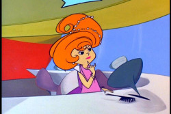 Jane Jetson choosing a hairstyle with the push of a button.  Ah, the future.