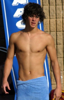 undie-fan-99:  Shaggy haired cute guy wrapped up in a blue towel at the pool! 
