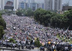 micdotcom: 14 photos from Venezuela’s massive anti-Maduro protests on Wednesday Venezuelans swarmed the streets of Caracas for “the mother of all protests” on Wednesday amid a deepening economic crisis that shows no signs of abating. According to