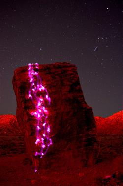 lasvegaslocally:  Rock Climber with Glowsticks outside Las Vegas   This is cool