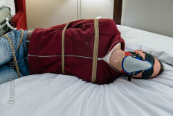 freavebond:Go ahead and struggle! Tight fist mitts, roped through his belt loops, I don’t think he was going to get loose. Sock gagged, mouth sealed shut with tight tape… some nice aromatherapy for the ride, too…