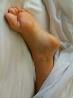 toered:  Barefoot sleeping wife