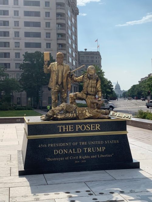 noirandchocolate: whatbigotspost:   blue–folder: ‘The Poser’ at Freedom Plaza, Washington DC by Bryan Buckley   Golden ‘Statues’ Memorializing Donald Trump’s Most Divisive Moments Have Popped Up Around Washington, D.C.    During the installation,