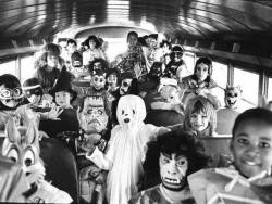 sixpenceee: Kids dressed for Halloween on a school bus. 1980s.