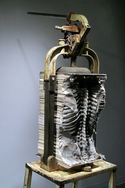 Maskull Lasserre, &ldquo;Lexicon (City of Ottawa)&rdquo;, human spine and ribcage carved into a compressed stack of daily newspapers, 2008, carved newspapers, mechanical press