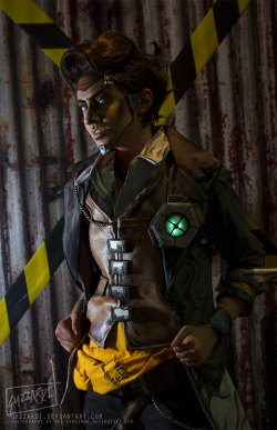 protowilson:  guzzardiart:  Borderlands 2 cosplay with our life-size Claptrap model/propMel Guzzardi as Zer0 and Shenae Guzzardi as Handsome Jack. All costumes, props and Claptrap are handmade and hand painted by us. Video of Claptrap doing his thing