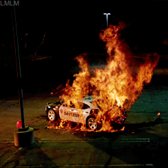 lilmisslydiamartin:  Ryan Kelley aka Deputy Parrish [ and the burning Sheriff’s car ] in the Teen Wolf Season 4 Mid-Season Promo 