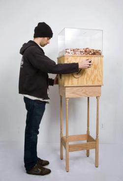 bencrowther:  This machine allows anyone to work for minimum wage for as long as they like. Turning the crank on the side releases one penny every 4.97 seconds, for a total of ů.25 per hour. This corresponds to minimum wage for a person in New York.