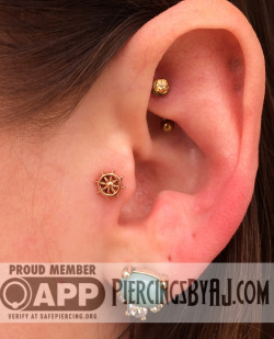 piercingsbyaj:  Fresh 16g tragus piercing featuring a 14K rose gold ship wheel from Body Vision Los Angeles to go along with the rook piercing I did a few weeks ago featuring a 3mm prong set genuine honey topaz from Anatometal!