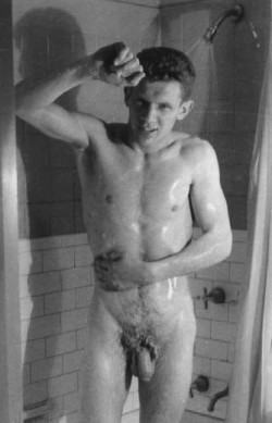The quality of this old photograph is not very good and it is small.Magnificent, spontaneous capture of this handsome young man in the shower. Fascinating old plumbing fixtures and tile, and lighting that casts his shadow.Wonderful vintage nude image