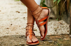 sandalsandspankings:  Strappy, lace up leather sandals on pretty feet.