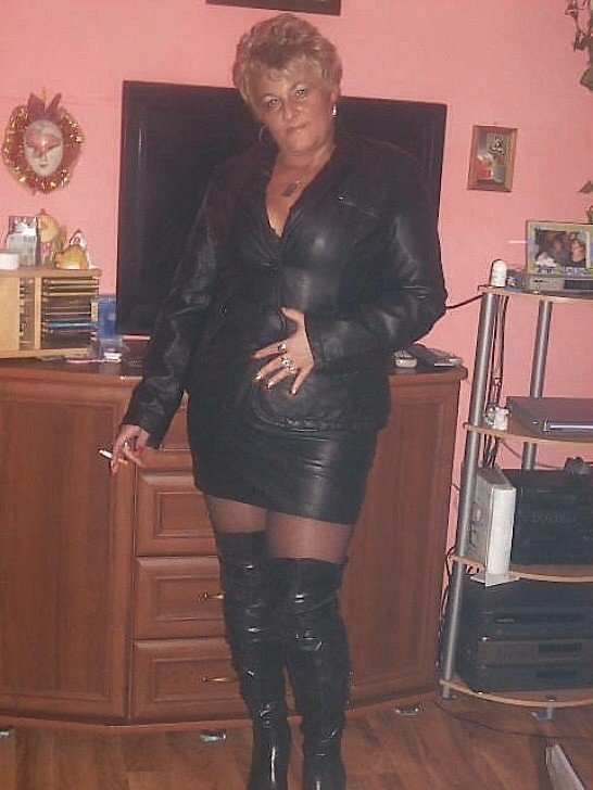 Mature woman wearing leather pants