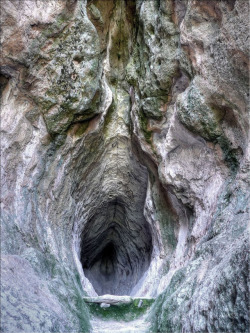 jabberwockypie: patrickat:  bernardperroud:  Utroba Cave in the Rhodope mountains, Bulgaria. Carved by hand more than 3000 years ago (?), it was rediscovered in 2001. Archeologists  hypothesize that an altar built at the end of the cave, which is about