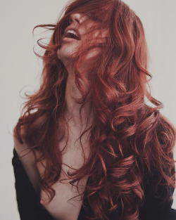 heavenlyredheads:  templeofginger:  Moaning redhead with long curly hair and her top falling off.