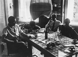 barcarole:   Vladimir Mayakovsky, Varvara Stepanova, Osip Beskin and Lilya Brik sitting at a table in 1926. Photo by Alexander Rodchenko.   https://painted-face.com/