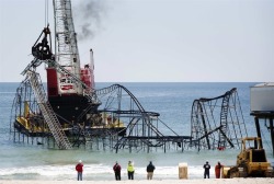 destroyed-and-abandoned:  A roller coaster that was plunged into the Atlantic Ocean after Superstorm Sandy ripped through the Jersey Shore last October and became a symbol of the devastation was being demolished Tuesday afternoon. The partially submerged