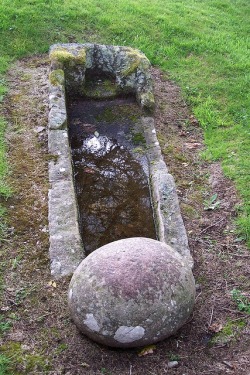 Early Medieval Grave, Barevan Chapel, Cawdor district, Scotland. There is a question as to whether or not the round stone was placed because it was believed to be a witches grave.
