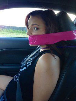 gagged4life:  Most car bondage shoots are designed so the damsel/s can quickly duck down in case another car (especially a cop car) comes close. This would be impossible in this pic with the way this damsel’s head is bound to the headrest of her seat