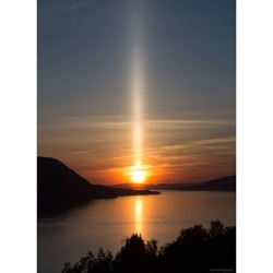 A Sun Pillar over Norway   Image Credit: Thorleif Rødland  Explanation: Have you ever seen a sun pillar? When the air is cold and the Sun is rising or setting, falling ice crystals can reflect sunlight and create an unusual column of light. Ice sometimes