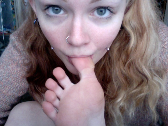 Cutie sucking her toes