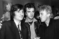 i-will-be-a-legend:Roger Taylor with Steve Strange and Ronnie Wood, 1987.