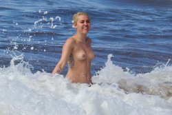 toplessbeachcelebs:Miley Cyrus (Singer) swimming topless in Hawaii (January 2015) - Part II Download the Full Set (38 Photos)